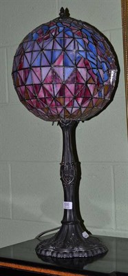 Lot 530 - A Tiffany style table lamp with globe shade