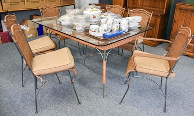 Lot 1358 - A Metal and Wicker Glass Topped Dining Table...