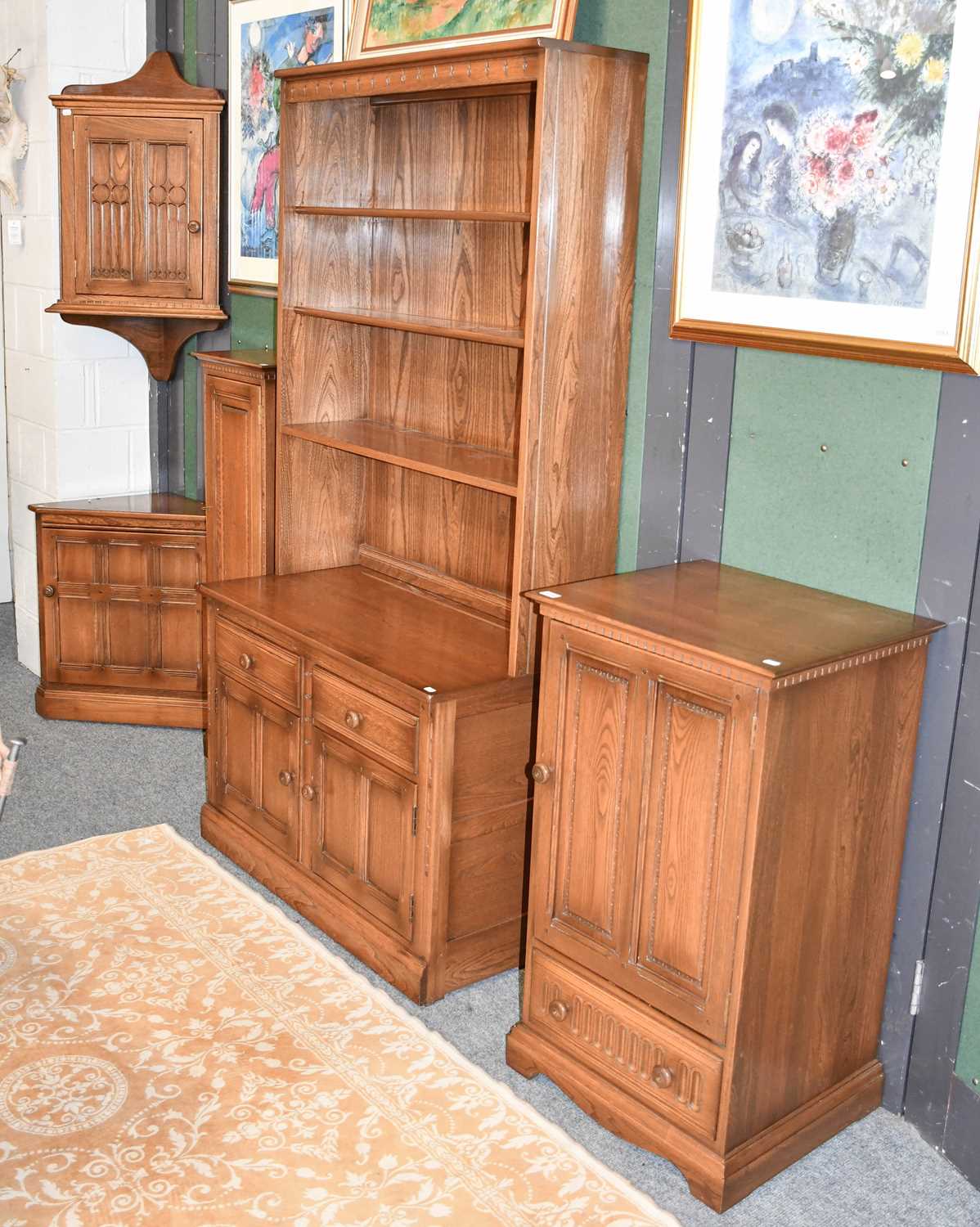 Lot 1350 - A Group of Ercol Elm Furniture: comprising...