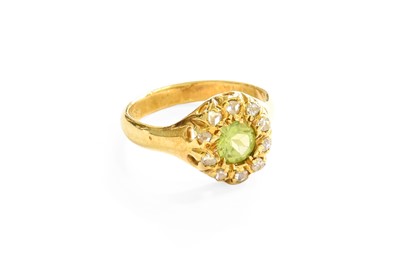 Lot 1 - A Peridot and Diamond Cluster Ring, the round...