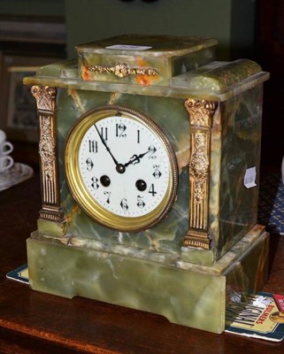 Lot 536 - An onyx two train mantel clock