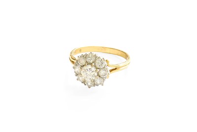 Lot 31 - A Diamond Cluster Ring, the central raised...