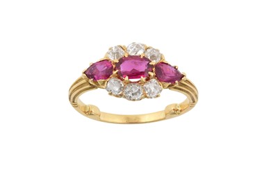 Lot 2137 - A Ruby and Diamond Cluster Ring the oval cut...