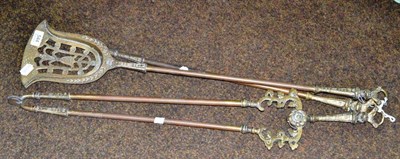 Lot 544 - A set of three brass fire irons