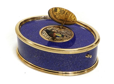 Lot 104 - A Faux Lapis Lazuli And Gilt Metal Oval Singing Bird Box, By Reuge