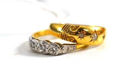 Lot 549 - An 18ct gold diamond three stone ring and another