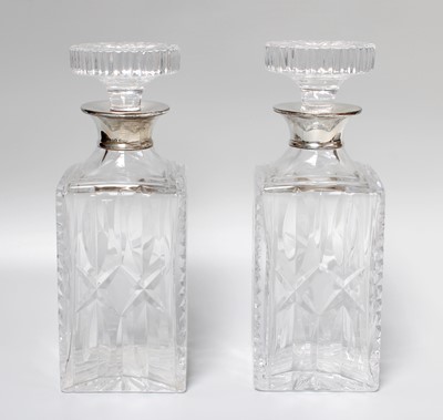 Lot 301 - A Pair of Silver Collared Decanters, London...