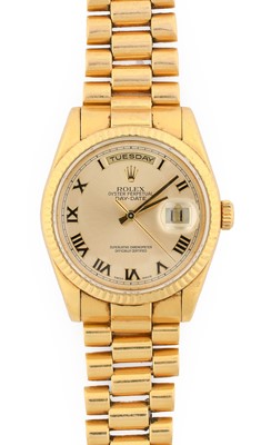 Lot 2134 - Rolex: An 18 Carat Gold Automatic Day/Date...