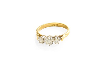 Lot 45 - A Diamond Three Stone Ring, the graduated...
