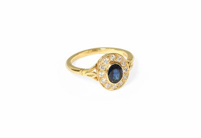 Lot 351 - An 18 Carat Gold Sapphire and Diamond Cluster...