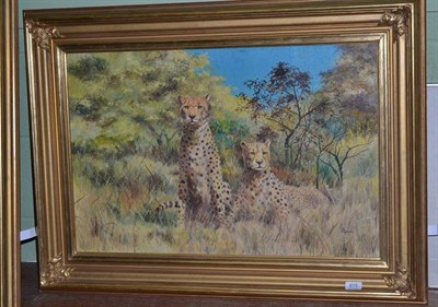 Lot 615 - *** Bryn ? (20th Century) pair of cheetahs at rest in the grass, signed, oil on canvas, 48.5cm...