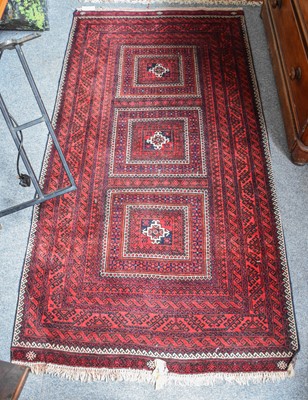 Lot 1001 - Baluch Rug, the field comprised of three...