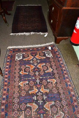 Lot 645 - Balouch rug Persian/Afghan frontier, the walnut field of serrated devices enclosed by narrow...