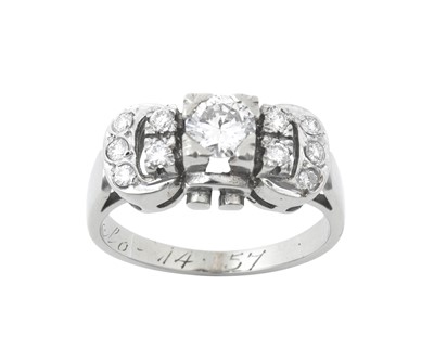 Lot 2060 - A Diamond Cluster Ring the buckle motif set...