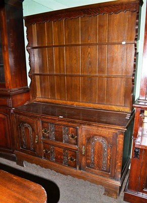 Lot 647 - An oak dresser with rack