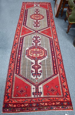 Lot 1012 - Sarab Runner, the crimson field with two...