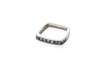 Lot 412 - An 18 Carat White Gold Sapphire Half Hoop Ring,...