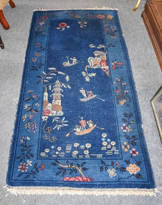 Lot 1015 - Chinese Rug, the deep indigo field with...