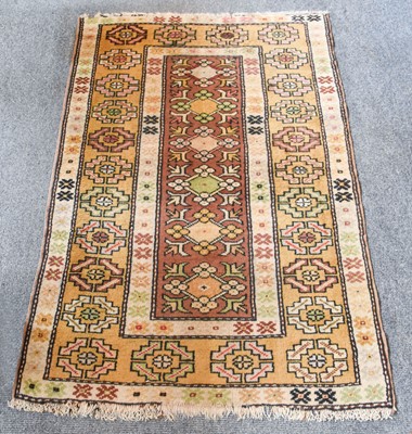 Lot 1016 - Melas Rug, the chocolate brown field with six...