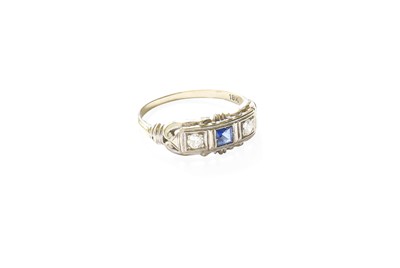 Lot 329 - A Synthetic Sapphire and Diamond Three Stone...