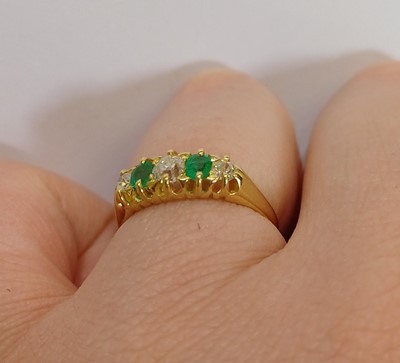 Lot 2154 - An 18 Carat Gold Emerald and Diamond Five...