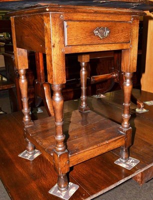 Lot 659 - A reproduction oak bedside cabinet fitted a drawer