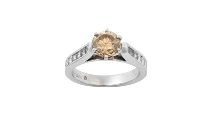 Lot 2189 - A Diamond Ring the fancy cognac round...