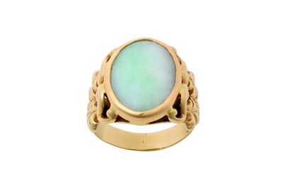 Lot 2132 - A Jade Ring the oval jade plaque in a yellow...