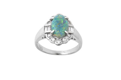 Lot 2186 - An Opal and Diamond Cluster Ring the oval...