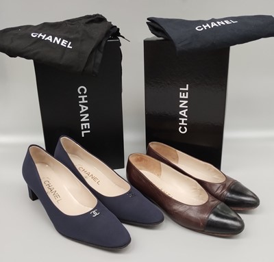 Lot 1159 - Pair of Chanel Navy Blue Court Shoes, mounted...