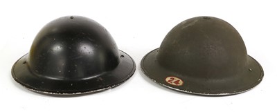 Lot 179 - Two Second World War Brodie Helmets, one with...