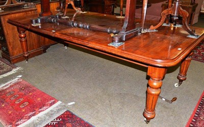 Lot 678 - A Victorian mahogany wind-out dining table