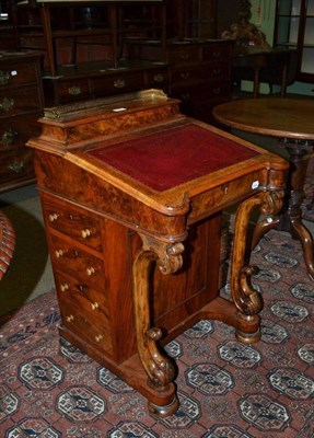 Lot 697 - A Victorian walnut Davenport with brass gallery