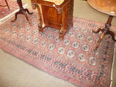 Lot 700 - A Bokhara rug with maroon field