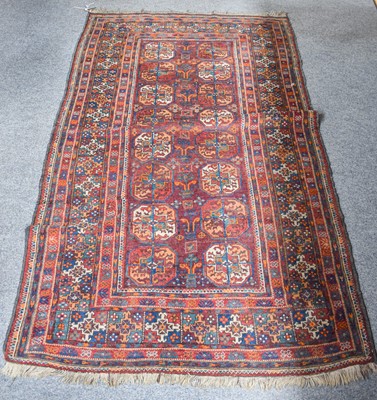 Lot 1013 - Baluch Rug of Turkmen Design, the aubergine...