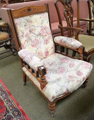 Lot 708 - A late Victorian walnut and ebonised armchair