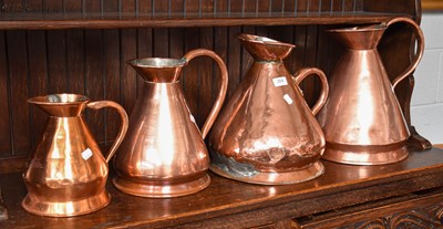 Lot 264 - Four Graduated 19th Century Copper Harvest Jugs