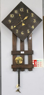 Lot 1295 - An Arts and Crafts Oak and Brass Mounted...