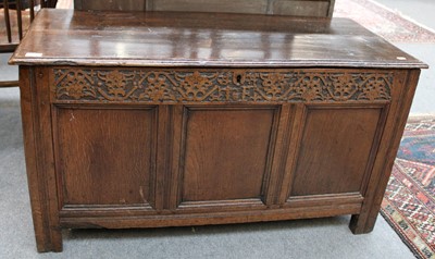 Lot 1244 - An 18th Century Carved and Panelled Oak Coffer,...