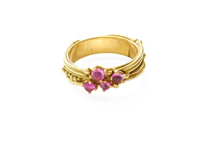 Lot 356 - A Synthetic Ruby Ring, four round cabochon...