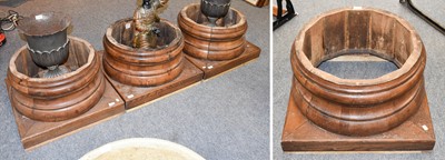 Lot 1429 - A Set of Four Carved Wooden Column Bases, on...