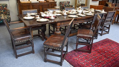 Lot 1363 - An Oak Draw Leaf Dining Table, on carved and...