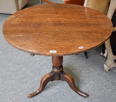 Lot 1164 - A George III Provincial Oak Tripod Table, on...