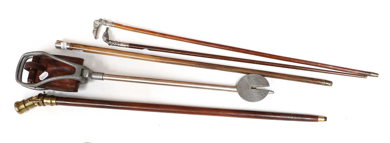 Lot 104 - A Silver Topped Cane, two white metal swagger...