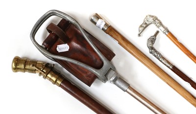 Lot 104 - A Silver Topped Cane, two white metal swagger...