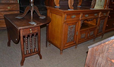 Lot 754 - A Victorian carved oak sideboard with brass handles and an oak drop leaf table