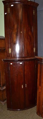 Lot 767 - Two George III mahogany bow fronted wall hanging corner cupboards