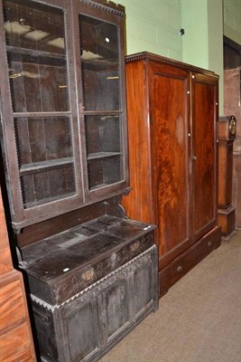 Lot 769 - An Edwardian mahogany wardrobe and a glazed stained oak cabinet