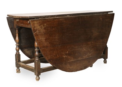 Lot 296 - An Oak Six-to-Eight-Seater Dropleaf Dining...