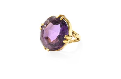 Lot 360 - An 18 Carat Gold Amethyst Ring, the oval mixed...